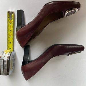 Maroon color pumps with silver brooch detail by Franco Sarto. Pre -owned. 8.5 M